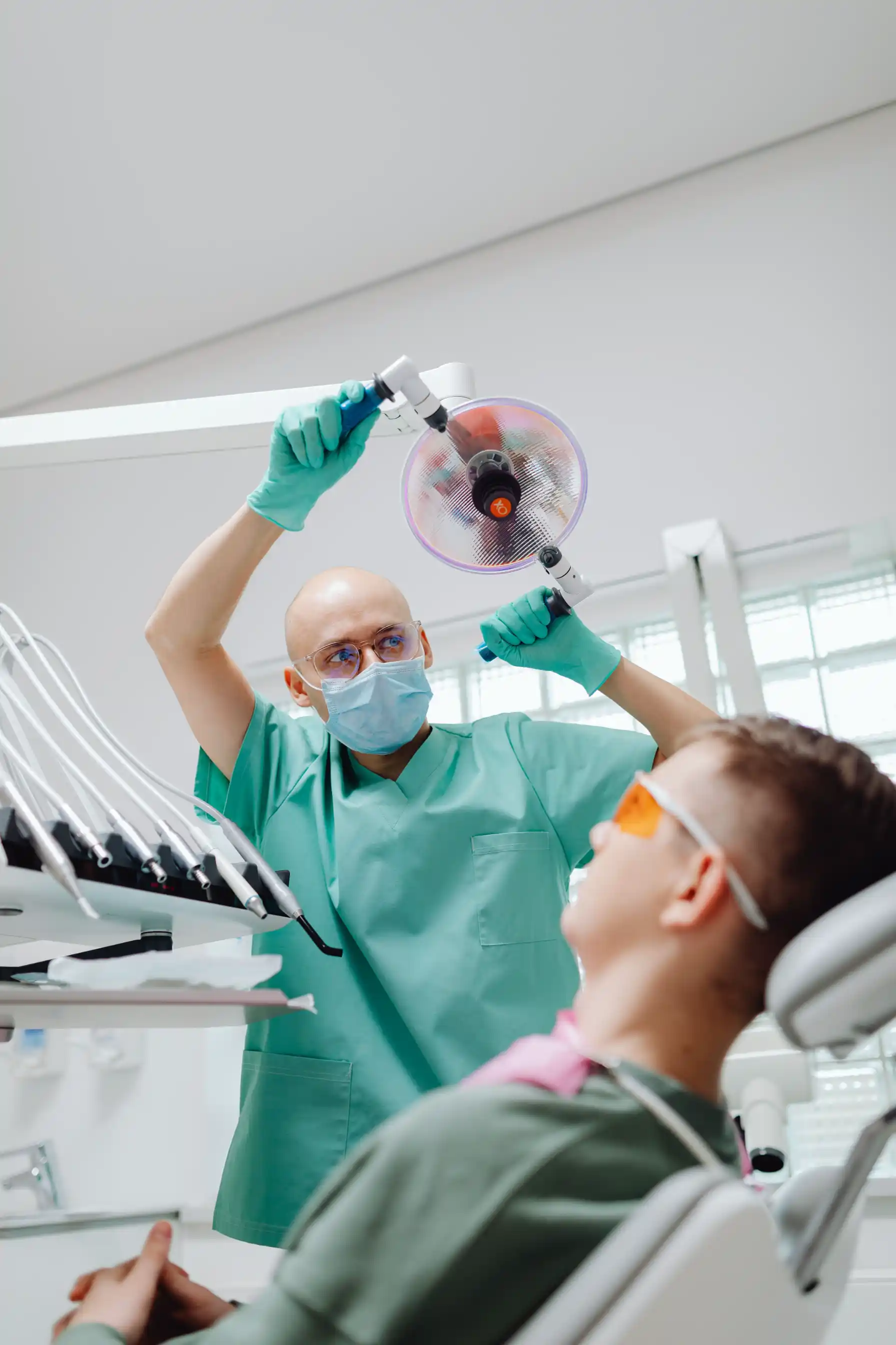 Dental hygienist with a patient during clinic care