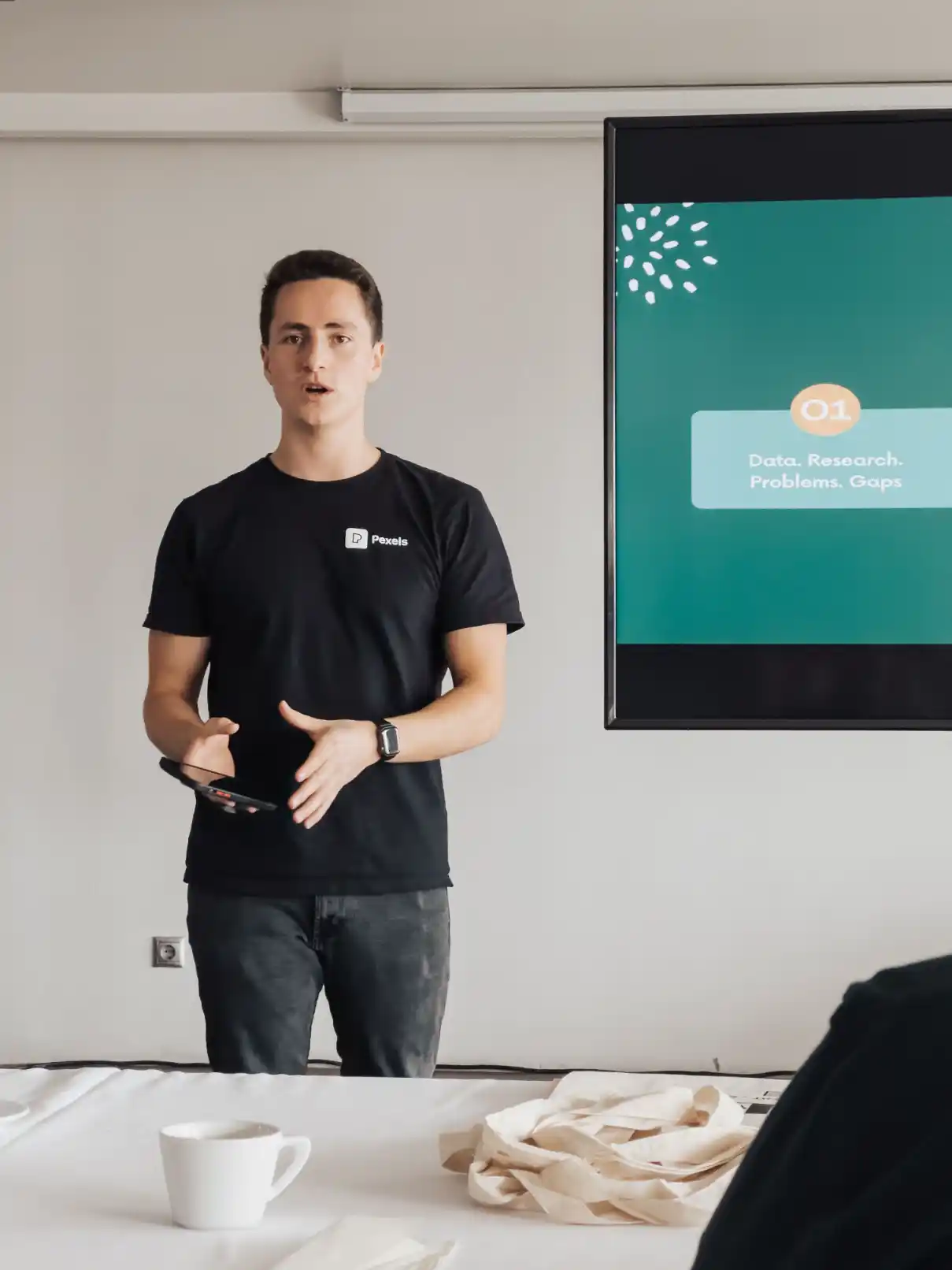 Founder presenting market research and competitor analysis to a team